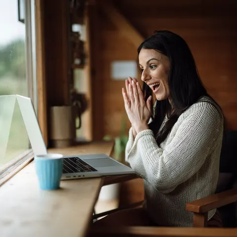 Woman practicing during a telehealth video session